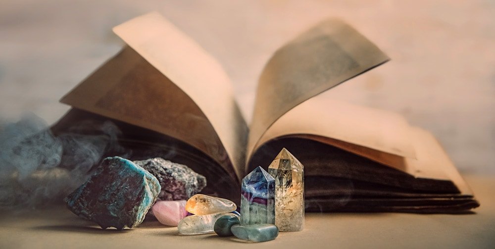 Crystals by a book