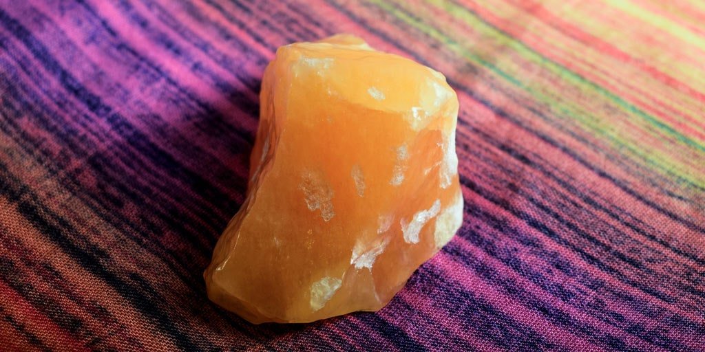 Can orange calcite go in water?